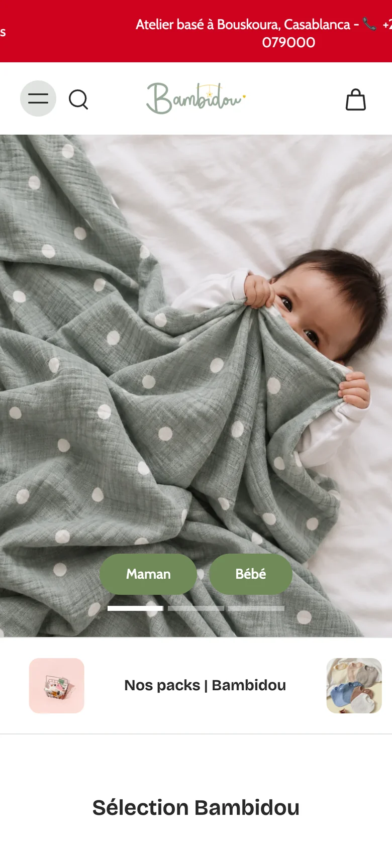 The same Bambidou store on a phone: the red announcement bar, a condensed header with menu, search and basket icons, and the bathrobe photograph above stacked category links.